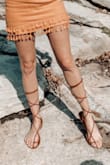 You have to make sure you tie them just right so your toes don't come over the front of the sandal. I absolutely love them though. You can tie them around your ankle or wrap them up your legs.
I'm between an 8 1/2 and a 9. I got the white pair in 8 1/2 because they didn't have 9, and I got these in 9. Both fit fine so if you are in between sizes, either will do. - Megan D.