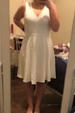 The dress is made well and is a good thick material, however it is not the length I expected. It's down to my knees and I was expecting mid thigh like is shown on the model. If you're looking for a longer dress this is perfect. It also ran a little bigger than expected but could be because I have no boobs, but it was very unflattering on me. - Peyton K.