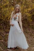 I took a chance with this dress, I usually don't buy such expensive items online, but I really needed a maternity dress for some announcement photos. I'm only 17 weeks pregnant so I'm not huge yet, and the dress fit snugly. Would have been prefect size had I been my normal weight (115 lbs). Only thing I would change are the straps, they're a little too long for me and make the dress lay a little odd in the back and how it falls to my midsection. I sewed the shoulder straps up about an inch on each side and they're PERFECT NOW. Over all, a great buy. Great quality and got here early. - Kylee M.