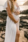 I absolutely loved this dress for my maternity photoshoot, but it did run small on my chest for my maternity measurements (I was 23 weeks at the time of the photoshoot). Since I'd rather have this dress fit post-pregnancy I made it work. You could also buy a slip or lacy bralette to solve that problem if pregnancy made you extra busty. - Jennifer M.
