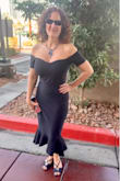 Dress is little hard to put on as you have to put it on over your head and it's a snug dress. But as it fits snug, once you pull it down and on, it's stretchy enough to cling and not too stretchy that it moves around. Well made. I got many compliments! - Michele A.