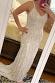 This dress is really pretty. The way the back of the dress drapes into a train, the lace pattern, and the simple v neck tank. The body-hugging fit really showed off my curves. I have ordered four different dresses On Lulus for my beach wedding and this placed third.  Beautiful dress but I chose to go with another. - Angela R.