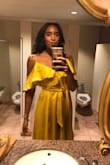 I've worn this for multiple weddings and special events and every time I got showered with compliments. The mustard color makes your skin glow and the fabric has the perfect amount of shimmer. BUY IT! true to size!! - Amber W.