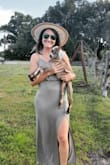 Ugh! I absolutely love this dress! It's very comfortable and clings to all the right places. It's stretchy but doesn't ride up and the slit is placed perfectly. - Kristen S.
