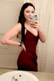 I loved this dress. The material was a little stretchy and super comfy! I ordered both a medium and a small and the small ended up fitting perfectly. It does ride up a little bit, but nothing unbearable. Overall a great party dress! - Amber F.