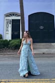 I love this dress. It's so pretty and flirty. The back straps allow you to adjust it to your bust size. I'm 5'2" so I had to take it to the tailor. I got this dress on sale so didn't mind that I had to do extra work. - Lena M.