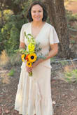 This dress is stunning. Used it for our 10 year anniversary vow renewal. Stretches and the slit is a nice touch! - Lindsey H.