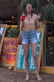 LOVE this top!! I go between a small and a medium and opted for the small in this. The shirt itself is cropped but it fits loosely enough everywhere else. I wore it with jean shorts (kind of high waisted) twice on vacation and seriously just loved it. It feels cute and sexy but somehow isn't crazy revealing. Can already tell this is going to be one of my go-to shirts this summer. - Sarah F.