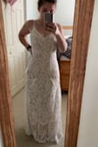 This dress is STUNNING and everything I ever wanted in a dress for 98USD!? WHAT??? When I got it I was a little disappointed. It fits perfectly, a little long however. But The front has that sort of ruffle and it looks like it doesn't belong. It makes two triangles in the front and is very odd, no one I show understands why. I'm going to get it altered completely off to see if I like it better. Other than that its a gorgeous dress. Perfect for a 2nd dress for reception. - Rachel J.