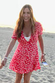 I absolutely love this dress, I've already worn it twice and just got it. I ordered a medium just in case, because I have a large chest. But I probably could've ordered a small. It is very low cut so a cute camisole works well if needed. Perfect with white sneakers. I might buy the other color - Ashley B.