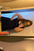 The dress is a surprisingly thick material, which I really like. Definitely low cut, but not too bad! The fabric is also nice and stretchy and very comfortable. Dress falls to my knees. - Linnea R.