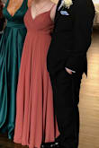 It is so beautiful!! Silky material with a slip underneath. A little heavy, but totally manageable. It looks exactly like the photo and is gorgeous! It was long. I will need to wear heels/get it tailored, but it is so affordable! I love this dress. If you are on the fence about getting it for graduation, prom, sweet 16, whatevs, just get it!!!!! - Lindsey C.