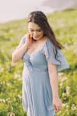 The color of this dress is stunning and the fit is very flattering! It looked absolutely fabulous in my engagement pictures and my photographer said it photographed very well! Would absolutely recommend this dress. I have a regular sized bust and larger hips so this dress fit nicely if you're a similar size! Probably could've fit a medium but I like the extra length a large gives. - Amanda R.