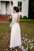 This dress was my wedding dress dream come true! When I first tried it on, it was so big up top (I'm very flat chested) and I was afraid it wasn't going to work out..but I went to a seamstress and she took the shoulders up and shortened it and it was absolutely perfect. - Katherine U.