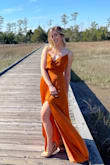 Bought this for engagement pictures but wore it for a wedding as a test drive. LOVE this dress! I've never received more compliments and I felt great all night! It's definitely small chest friendly and flows nicely for those that have a small waist with bigger hips (for me at least). It's a little long but that didn't stop me from ripping the heals off and dancing all night! Material is soft and not too hot, and with a breeze you'll be feeling great! - Julie N.