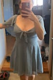 The dress is a great material. Fits me well and has a zip closure on the side. I'm not wearing a bra in the photo, but I'll probably wear one out with it. No support for boobs otherwise. The dress is more blue than photographed online, but I like the colour it came in a little more. Second photo is the dress outside in natural light. Overall, really happy :) - Emily F.