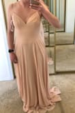 I am absolutely in love with this dress! The only reason I selected that the dress runs slightly large is because it is really long, I have at least 4-5 inches on the floor. Definitely going to get the dress hemmed when I decide on what shoes to wear. The top of the dress (bust and waist) fit me perfectly! I am so pleased. There's plenty of room in the hip area as well. I need a little help in the bust department, so I am planning to wear an adhesive bra for sure. All in all, the back detail is GORGEOUS and I am so excited to wear this dress as a bridesmaid! - Hope Z.