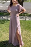This dress is beautiful. It fit me perfectly. The only thing I had to get altered was the length. The seamstress did an amazing job hemming it up. I wore this dress to 2 proms and absolutely loved it. I got very lucky to find a dress that had sleeves and a covered back. The lower half in the back has a slight cut out, but the dress is still so elegant and non-reveling. All the other prom dresses I had seen were too low cut, backless, strapless, sleeveless, too short, too tight and downright ugly. I tried to find another dress after purchasing this one, for another dance, but I was unable to find one as nice as this dress. I wanted to feel comfortable in my dress, and this was the prefect dress. It was well worth the money spent. - Corinne B.
