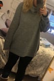This sweater is amazing! It definitely runs big but just as you'd expect! It's long and so warm and soft! If you're looking for a less chunky look I would size down! - Eve R.