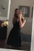 This dress fits in all the right places, if you are worried about the front being to low, it isn't in any way! Love this dress - Nicole K.