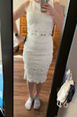 I'm normally a small but can sometimes be a medium, and this set has no give, so I would definitely get a medium. I ended up not wanting to keep it at all, but wanted to share a photo in case it helps anyone! I wish the top had a zipper, as I'm not large in the chest and had troubles getting it on and off. The skirt was tight in the hips. It fit nicely in the waist. - Samantha O.