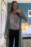 I absolutely love this shirt. It runs bigger than expected, but it's easy enough to tie in a knot or tuck in. It's the perfect cute, casual shirt!  One photo shows it tucked in, the other is untucked. - Madie H.