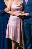 I love this dress! I read the reviews that said it runs large, so I got an XS (I'm usually a Small) and it did fit, but it was a bit tight, so I think Small would have been perfect for me. Either way, I loved it. The back is a show-stopper, it is my favorite part of the dress. 
I also read in the reviews that the sleeve falls down, but it was not the case for me, you just have to make the back string shorter. I used it for my engagement dinner and my fiancée and family loved it as well. - Teresa M.