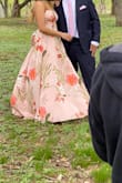 The dress is way too long for anyone 5'5" and under. I didn't have time to alter it before my engagement shoot, so I wore my highest heels (5.5 inches) but was still too long! Probably have to cut a good 10 inches and alter the slit to fit my height. Other than that, I LOVE the material - looks and feels expensive. I love the print design - very girly and romantic! Can't wait to wear it again! - Karlin A.