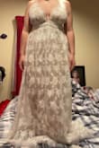 This dress was great and I really wanted to keep this dress but it was way too long. I was not able to walk in it and it's a little itchy, but very pretty! - Cassidy W.