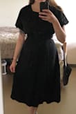 Fits perfectly and looks really cute. The fabric is a little bit on the heavier side so not a hot weather dress but it's very pleasant to touch. - Erna S.