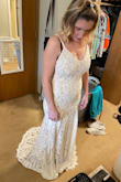 I was so surprised at the beautiful quality of the dress. (First dress I ordered elsewhere was not good) I love it! This is my wedding dress and can't wait to wear it. Yes it's quite long (I'm short. Standing on stool in pic) so going to have it altered. But the fabric/lace is just perfect. I cried! Hopefully so will my fiancé when I walk down the sand on August 21st!! Thank you for the perfect wedding dress! - Emme R.