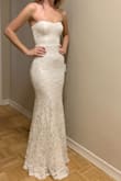 This dress is stunning. There are 2 light weight layers underneath and then the lace on top, giving it a high quality feel. The lace has a subtle sheen to it which looks amazing in person. I am about 95-98 lbs and I don't think it'll fit if I gain any weight. It does have some stretch to the lower portion of the dress but not so much in the bust. I'm 5'0 and wearing 2 inch heels in the pics. The back is high enough that I can wear a strapless bra. I've had the worst time finding mermaid dresses that fit a petite frame and I literally couldn't have asked for a better fit with this dress! - Erin S.