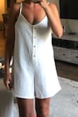 I'm 5'4 and unless I wanted to get it hemmed up 3-4  inches so it would fall at the same length as the model, I just feel like it looks frumpy. I love the simplicity of the cover up and it fits me like the model minus the length which is the deciding factor for me because with it being semi-baggy and longer I think if I kept this I would never wear it and regret buying it. If you are taller and/or ok with a longer/wider short if you are petite like me then maybe this would be for you but for me it's sadly going back. Just also FYI fabric is really nice I just ordered the smallest size available XS and usually am in between a size small and XS and this was just too big for my liking. - Jennifer G.