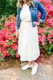 There is no give in the waist. It was a little tight but I ended up keeping it and wearing it to my bridal shower. I got lots of compliments! - Megan M.