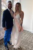 I wore this jumpsuit to my bridal shower and got so many compliments! Yes, its long, but although I'm short, I have long legs and wore heels. Comfortable! The only thing I didn't like was that the top would come loose, I had to grab a friend a few times to retighten the back! - Caroline G.