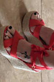 It's a beautiful shoe made well runs a little large. I generally wear between a seven and a eight depending on the shoe. 7 1/2 was almost a size and a half too big. Strap across the toe was big enough for my foot and my hand. I would definitely order whatever size you wear in a flip-flop. - RONNIE M.