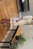 I came upon Lulus while I was looking for a white dress for an event.  I loved this dress. I am about 5'4" and it fell just below my knee but because it's flowy on the bottom and has the sheer strip I think it looked like it hit perfectly.  I found the waist to be fitted but not tight. The fabric is almost a little stretchy so the dress was super comfortable. I'd definitely recommend this dress! - Sara K.