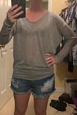 Absolutely love it! Ordered the XS and fits just like the picture: slim in the lower arms and loose around the body. Slightly see through, soft, and very breathable. - Sarah S.