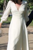 Wore this dress for wedding pictures. I am pretty flat-chested so I didn't have any problem with the bust but would not recommend this for someone with larger breasts. Other than that, it fits well and is adjustable due to the "wrap" part of the dress. Beautiful for pictures. - Megan G.