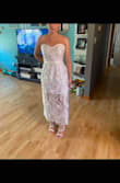 Plan on wearing this for my rehearsal dinner after I have it altered to my size! I knew it would be long for to my height! It's a little big around as well I can't wait to wear it once it fits! So beautiful in person I am holding the back in the photo so it would stay up! - Cheyenne G.