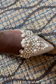 These flats are absolutely gorgeous. I bought them for my wedding. However, they are not true to size. They run small. Order up half a size or whole if half sizes aren't available. - Berline P.