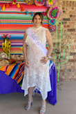 I loved this dress it was perfect for my bridal shower! I was able to wear a bra with it too. I probably could have gotten a large but I didn't want my lower belly to stick out more. Lace on the dress is beautiful and it is both comfortable and elegant. - Katie R.