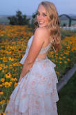 I bought this dress for my daughter to wear to an outdoor wedding.. it's a gorgeous dress. It is a deep V neckline, but fashion tape kept in it place. It was true to size. - Gael C.