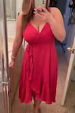 I bought this dress for my upcoming vacation to Mexico. It's always hard to fine cute longer dresses, but I really like this one. The length fits me more like a maxi which is fine. The wrap around was a bit difficult to figure out at first, but looks great altogether. The only thing I don't like about it is that it does show quite a bit of cleavage. I would like it to be a bit more secured. - Erika S.