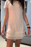 i ordered an XS even though i am usually a S because i saw quite a few comments saying it runs large. i am so happy i sized down! i think the dress is a little tad sheer so any undergarments need to be very light shades for sure, and the dress is a little short, but it's not any shorter than shown in the photo. I LOVE it overall. it is great quality, and very very comfortable, it can be dressed up or dressed down, which is great!!! highly recommend! - Nichole M.