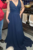This dress looks just as pictured. The quality is very nice. The length has to be adjusted only because the bridesmaid is super petite, under 5 feet tall. Fits perfectly at the waist. Will be ordering 4 more. - Melissa M.