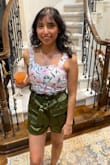These shorts are IT! So I normally wear medium bottoms, but if the bottoms are stretchy and/or roomy, I can do a small, just like I did with these! The waistline is veerrry stretchy, but firm, so it will pretty much fit your waist perfectly/naturally without constricting it. I wore these specifically for a night of dinner and drinks with my friends now that we're all vaccinated. I expected to have a food baby (and I did lol), and these shorts didn't make it uncomfortable. They are very flattering and work beautifully with a crop top. Can be worn with sneakers, sandals, or heels so you can go for a dressed-up or semi-casual look. The fabric is smooth and cool, too. I ABSOLUTELY recommend these! - Diane G.