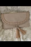 I love this clutch so much I got it in 2 colors. The ivory one is a bit darker in person. It looks more like a blush to me. It's a big clutch but true to the measurements in the description. - Paola P.
