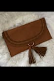 This clutch is everything! I got the brown one and it looks exactly like the picture. It's very spacious and trendy. The tassels were well wrapped so when it arrived the tassels were in perfect condition (which isn't always the case with other sellers). - Paola P.
