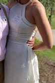 This fits just like it's shown on the model. I ordered silicone pasties, as a bra isn't possible, and they worked great. The fabric is thick and flows nice. The open back gives this simple dress a little something extra. - Breanne S.